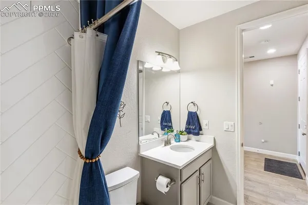 a bathroom with a sink a mirror and a shower