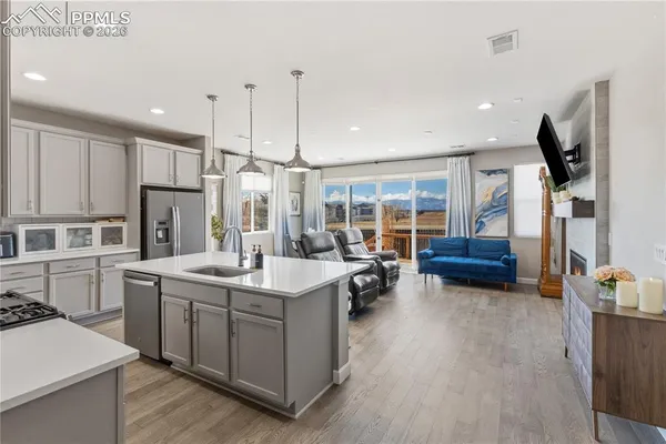a kitchen with sink cabinets and stove