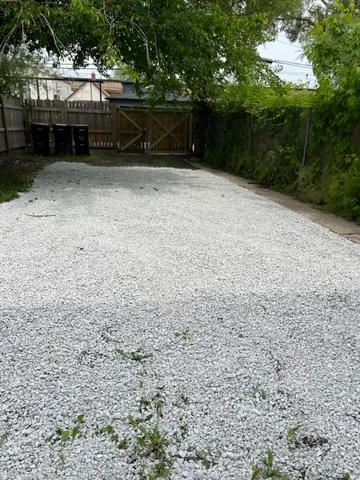 a view of outdoor space with wooden fence
