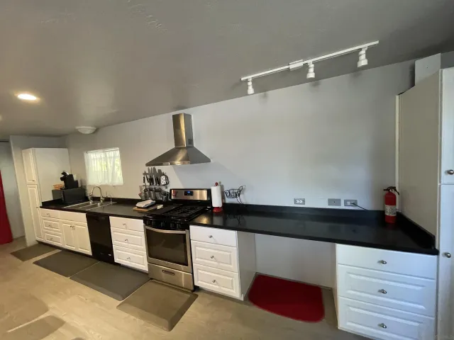 a kitchen with a sink and cabinets