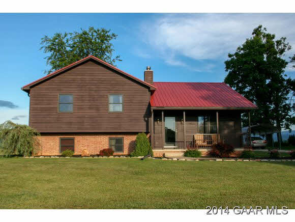 1462 Old Providence Road Raphine, VA 24472 - Photo 1 of 30 a front view of a house with a garden