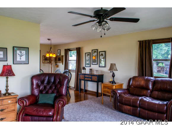 1462 Old Providence Road Raphine, VA 24472 - Photo 9 of 30 a living room with furniture a ceiling fan and a window