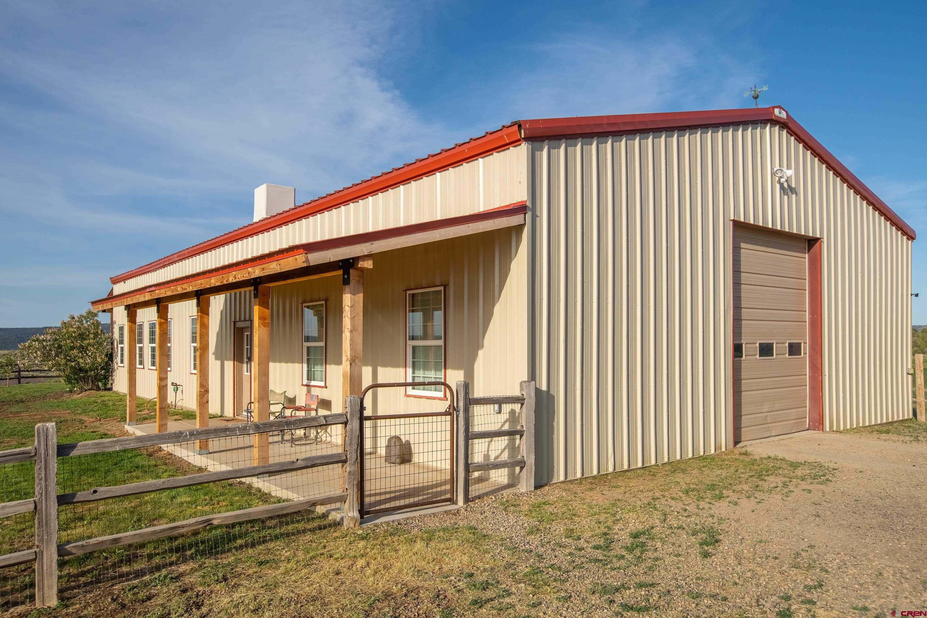 777 County Road 977 Ignacio, CO 81137 - Photo 4 of 45 a front view of a house with glass windows