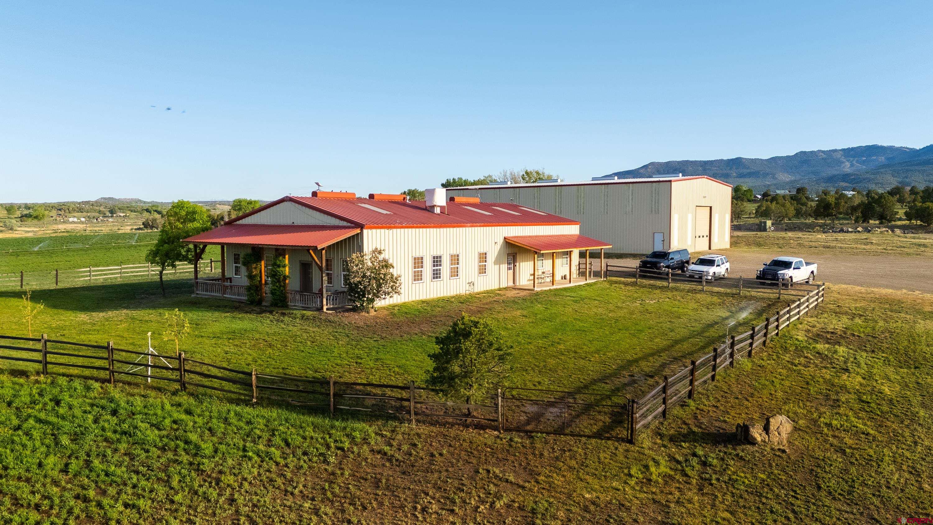 777 County Road 977 Ignacio, CO 81137 - Photo 9 of 45 a front view of a house with a yard