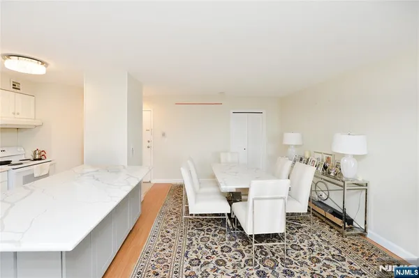 a large white room with a couch and a coffee table