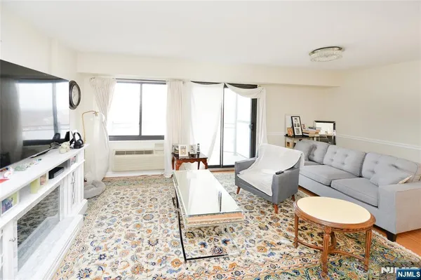 a living room with furniture and a rug