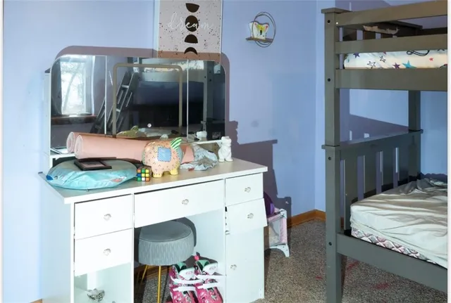 a bathroom with a sink a mirror and a toilet