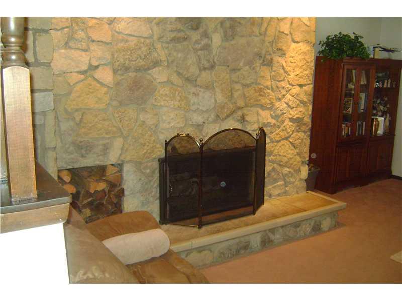 1022 Wren Drive McKees Rocks, PA 15136 - Photo 3 of 21 Living Room. Fantastic stone gas fireplace opens to living room and also to family room