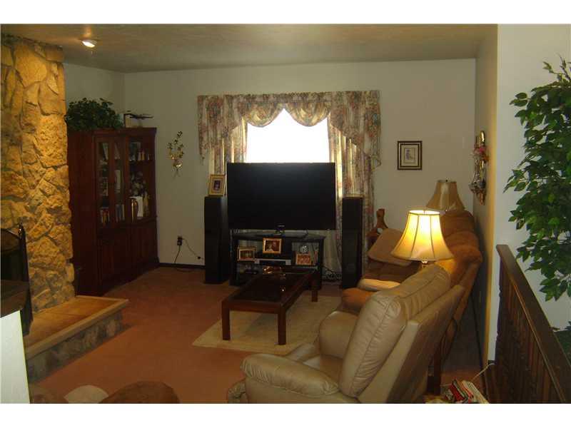 1022 Wren Drive McKees Rocks, PA 15136 - Photo 4 of 21 Living Room. Step down into living room from large entry. Recessed lighting accents the stone fireplace.