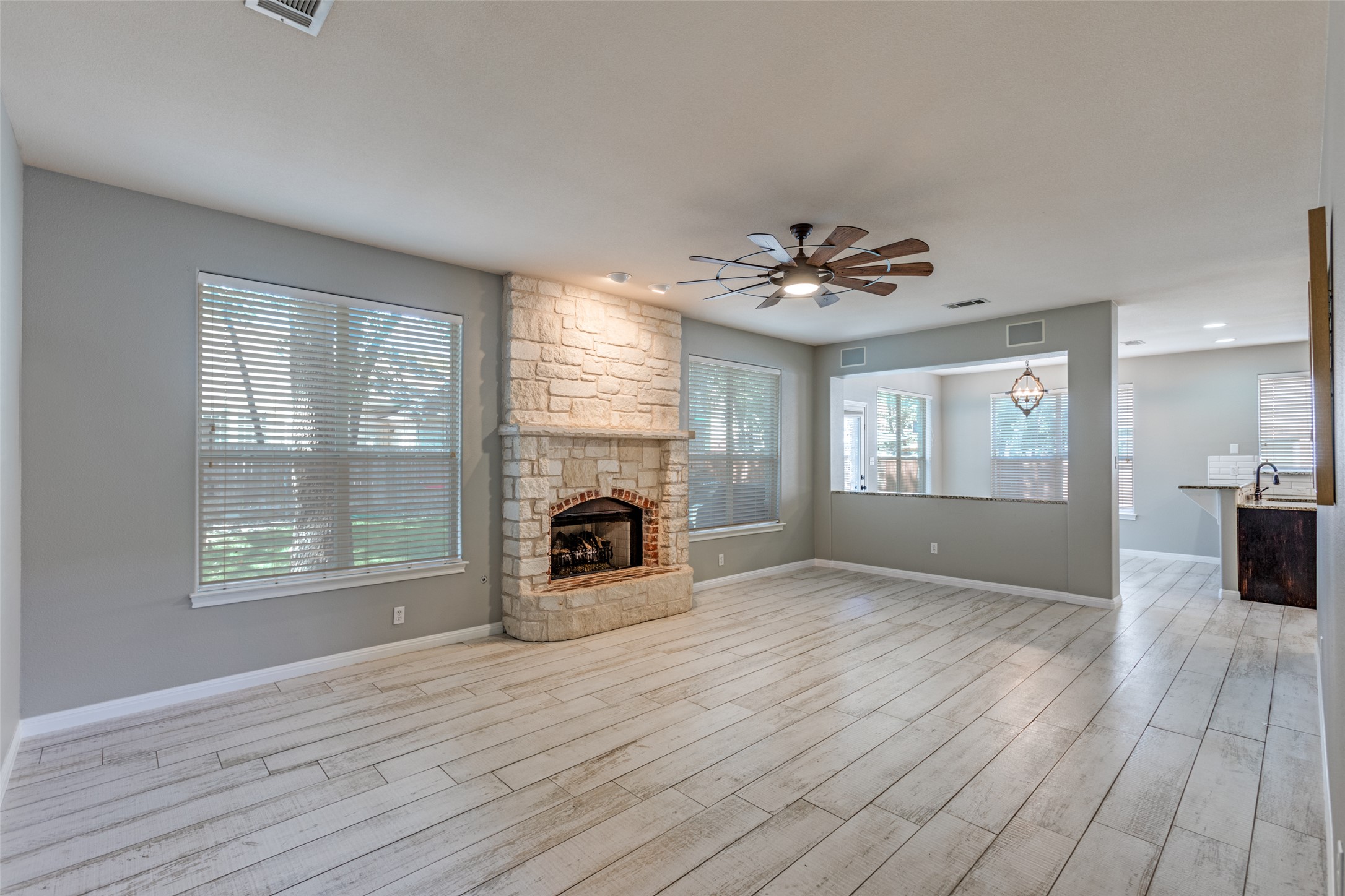 3729 Galena Hills Loop Round Rock, TX 78681 - Photo 4 of 33 a view of a livingroom with a fireplace and wooden floor