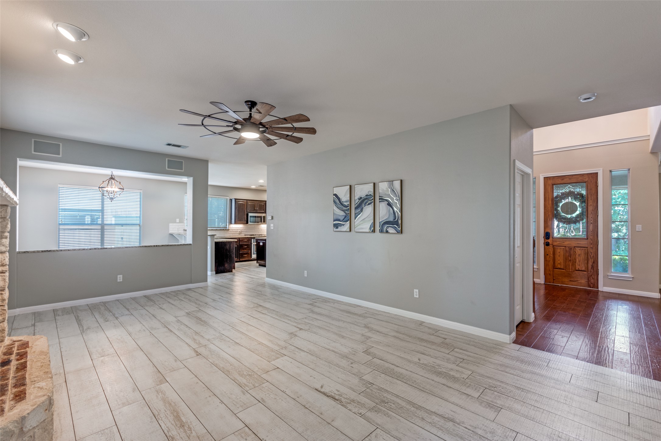 3729 Galena Hills Loop Round Rock, TX 78681 - Photo 5 of 33 a view of an empty room with window and wooden floor