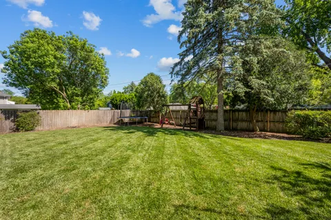 a view of a backyard with a garden