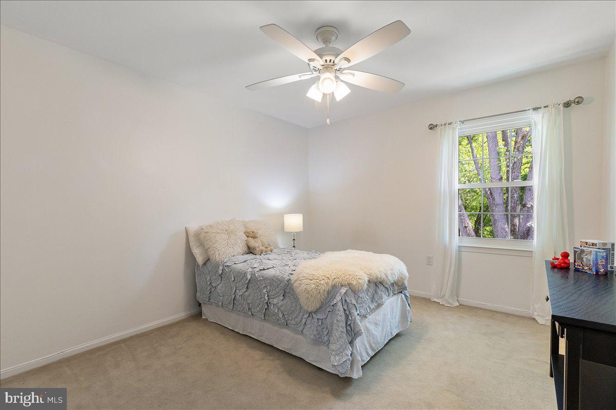 3 Strathmore Place Princeton Junction, NJ 08550 - Photo 20 of 29 a bedroom with a bed chandelier and a window