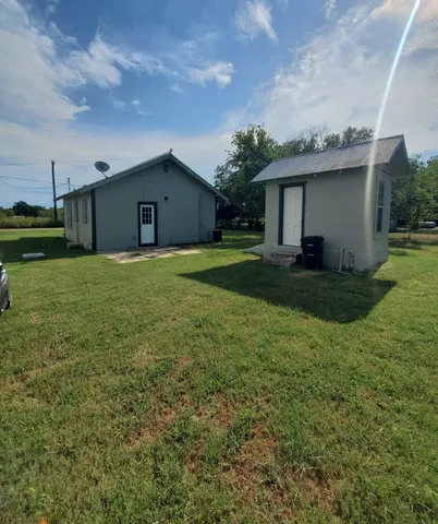 a house view with a backyard space