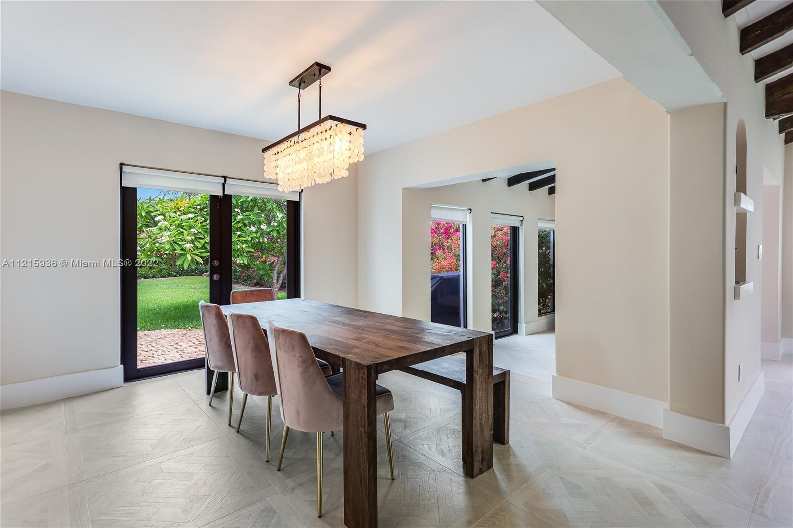 5135 Alton Road Miami Beach, FL 33140 - Photo 13 of 23 a view of a dining room with furniture window and outside view