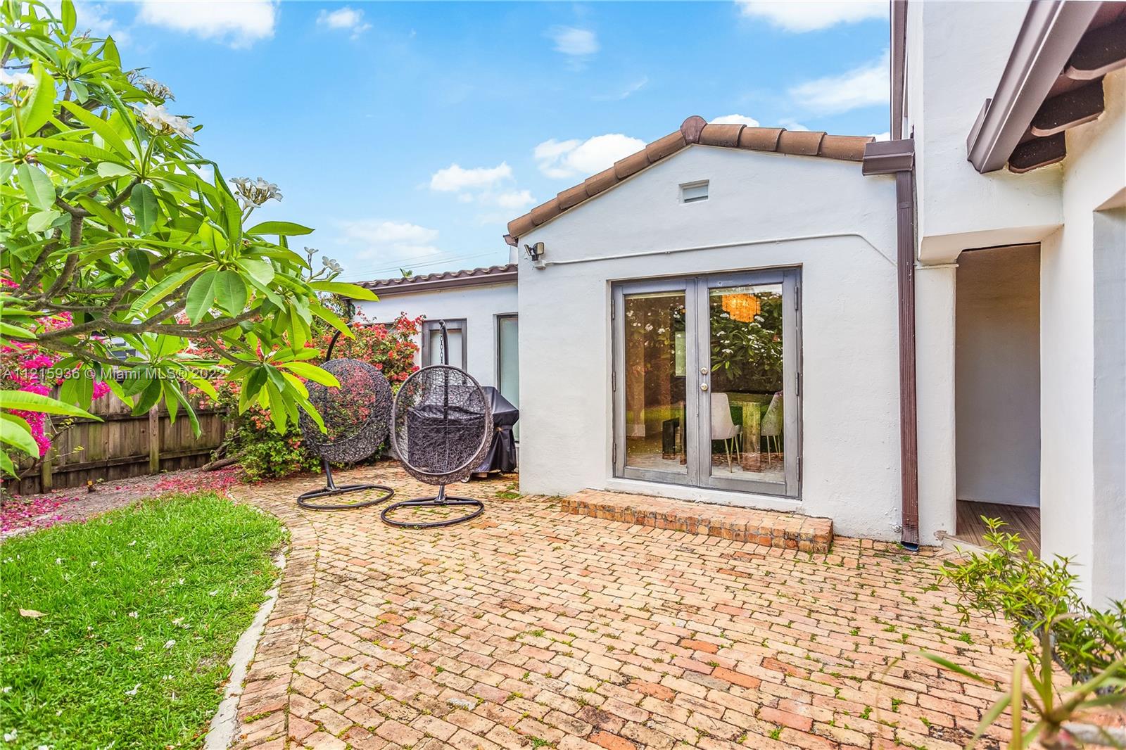5135 Alton Road Miami Beach, FL 33140 - Photo 16 of 23 a view of a porch with a yard