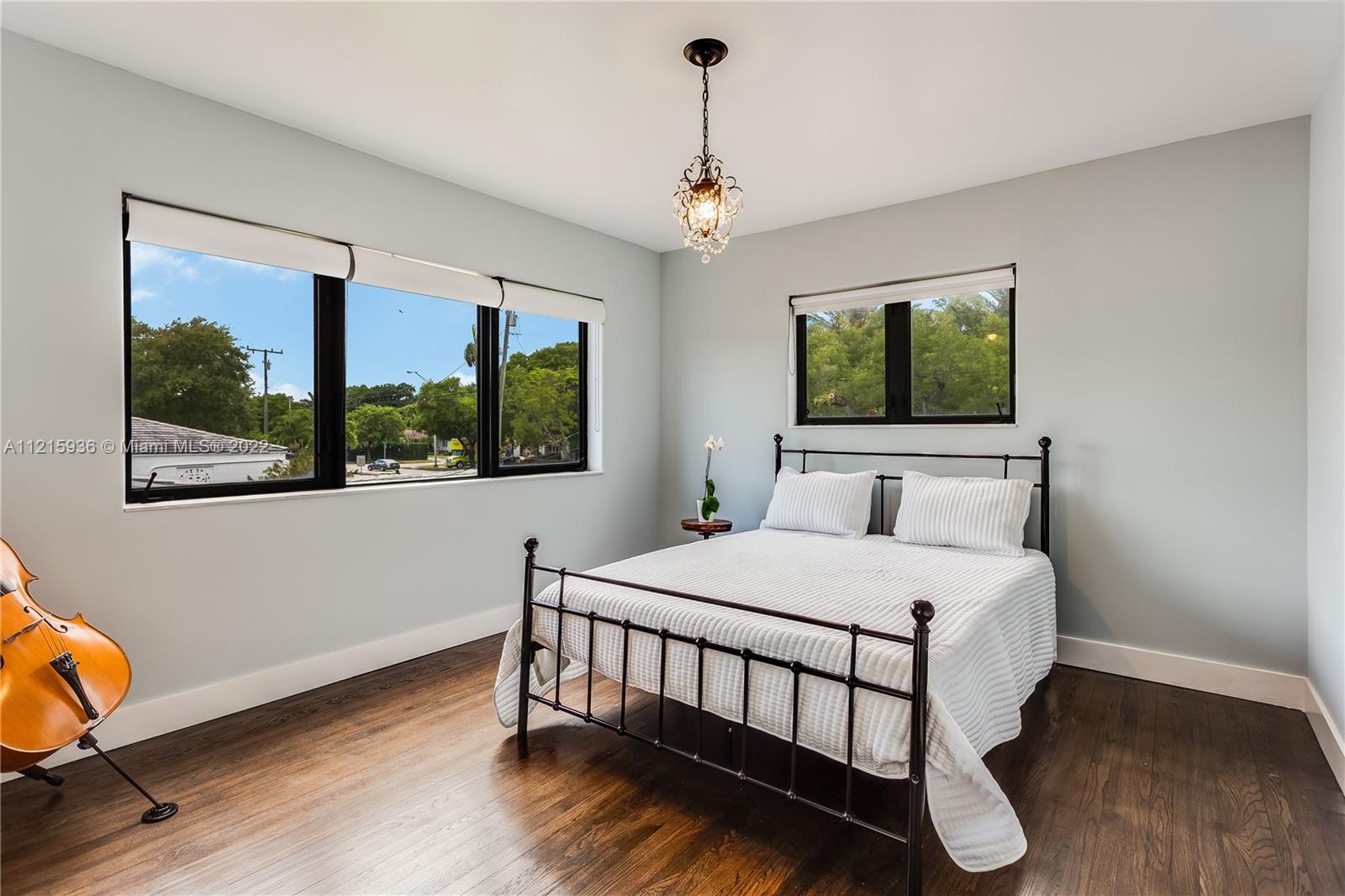 5135 Alton Road Miami Beach, FL 33140 - Photo 18 of 23 a bedroom with a bed and a window
