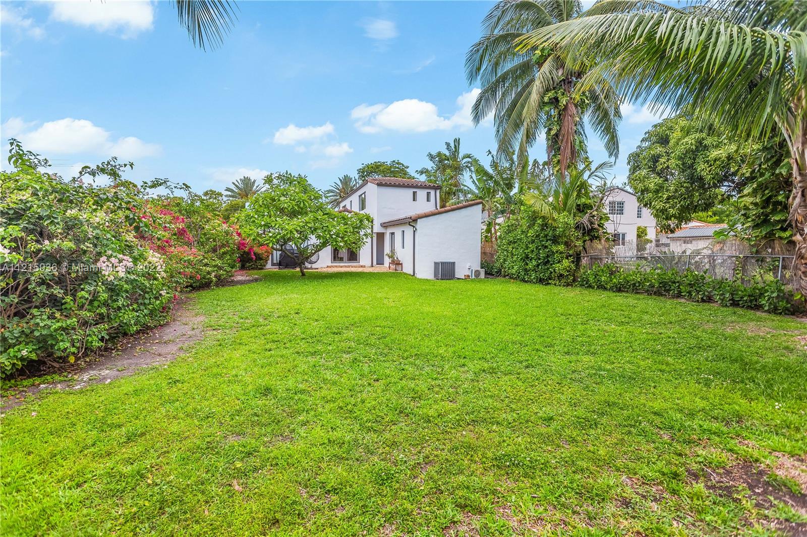 5135 Alton Road Miami Beach, FL 33140 - Photo 19 of 23 a view of a garden with a building in the background