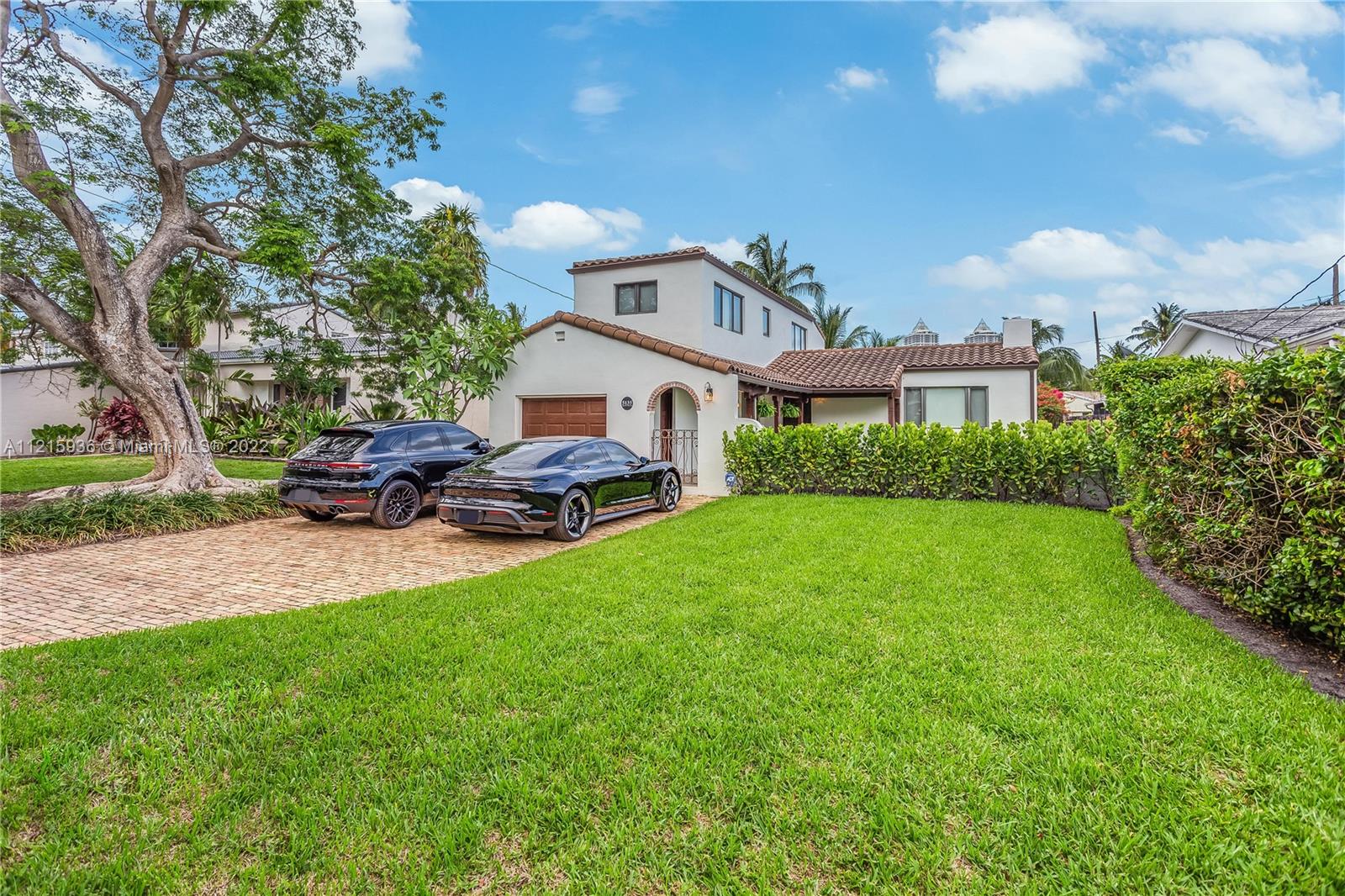 5135 Alton Road Miami Beach, FL 33140 - Photo 5 of 23 a front view of a house with garden