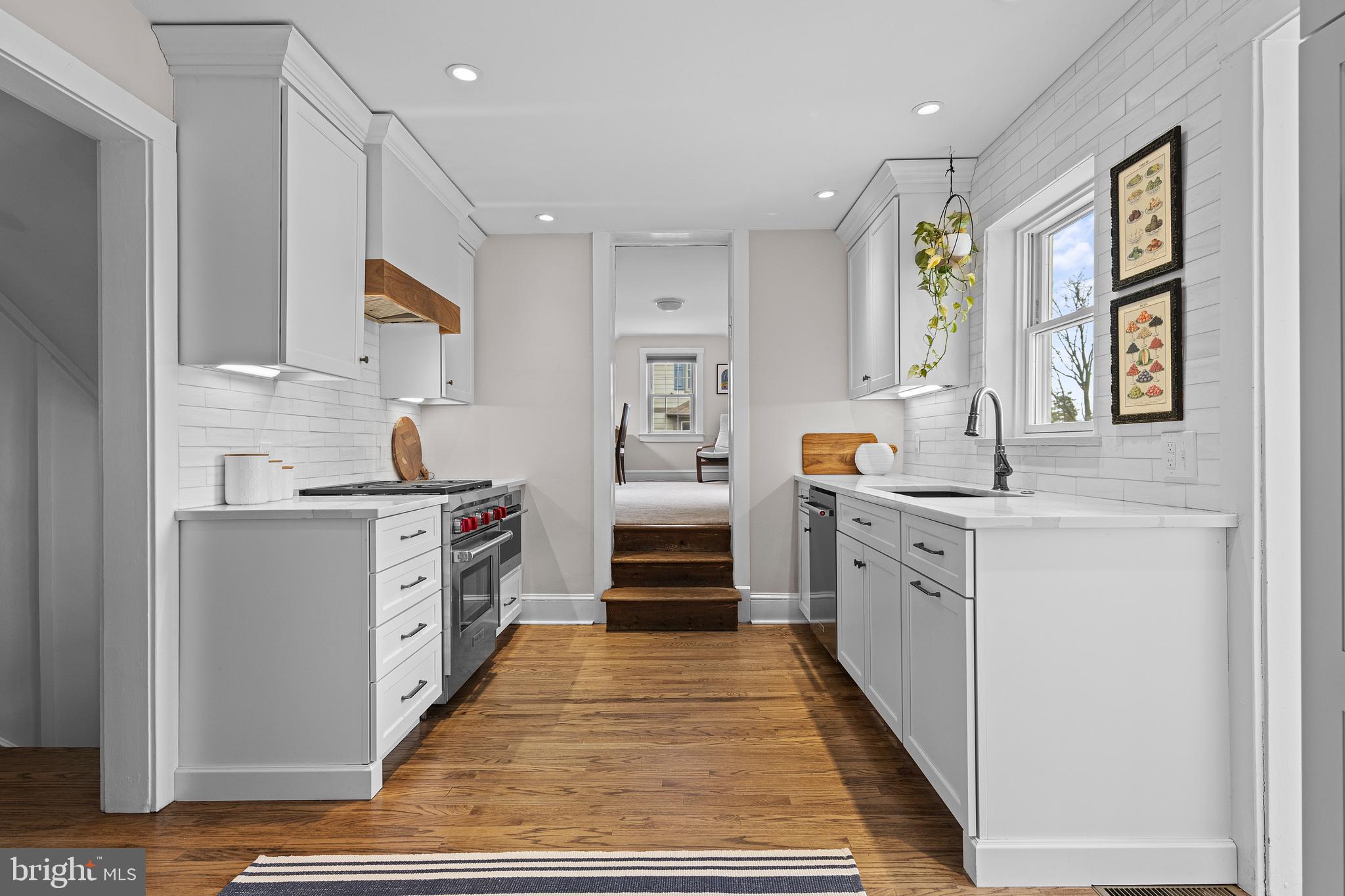 321 Conestoga Road Wayne, PA 19087 - Photo 11 of 28 a kitchen with stainless steel appliances granite countertop a stove and a sink