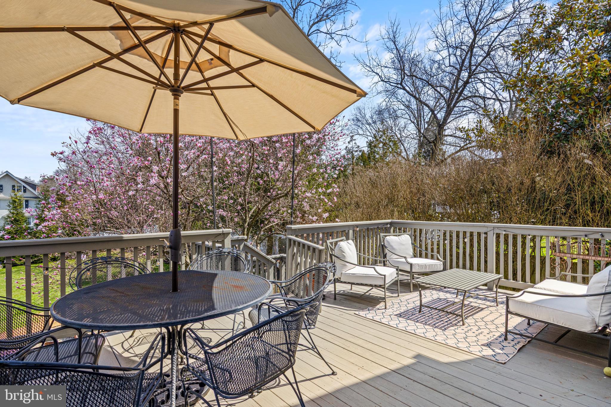 321 Conestoga Road Wayne, PA 19087 - Photo 14 of 28 a view of a chair and tables on the deck
