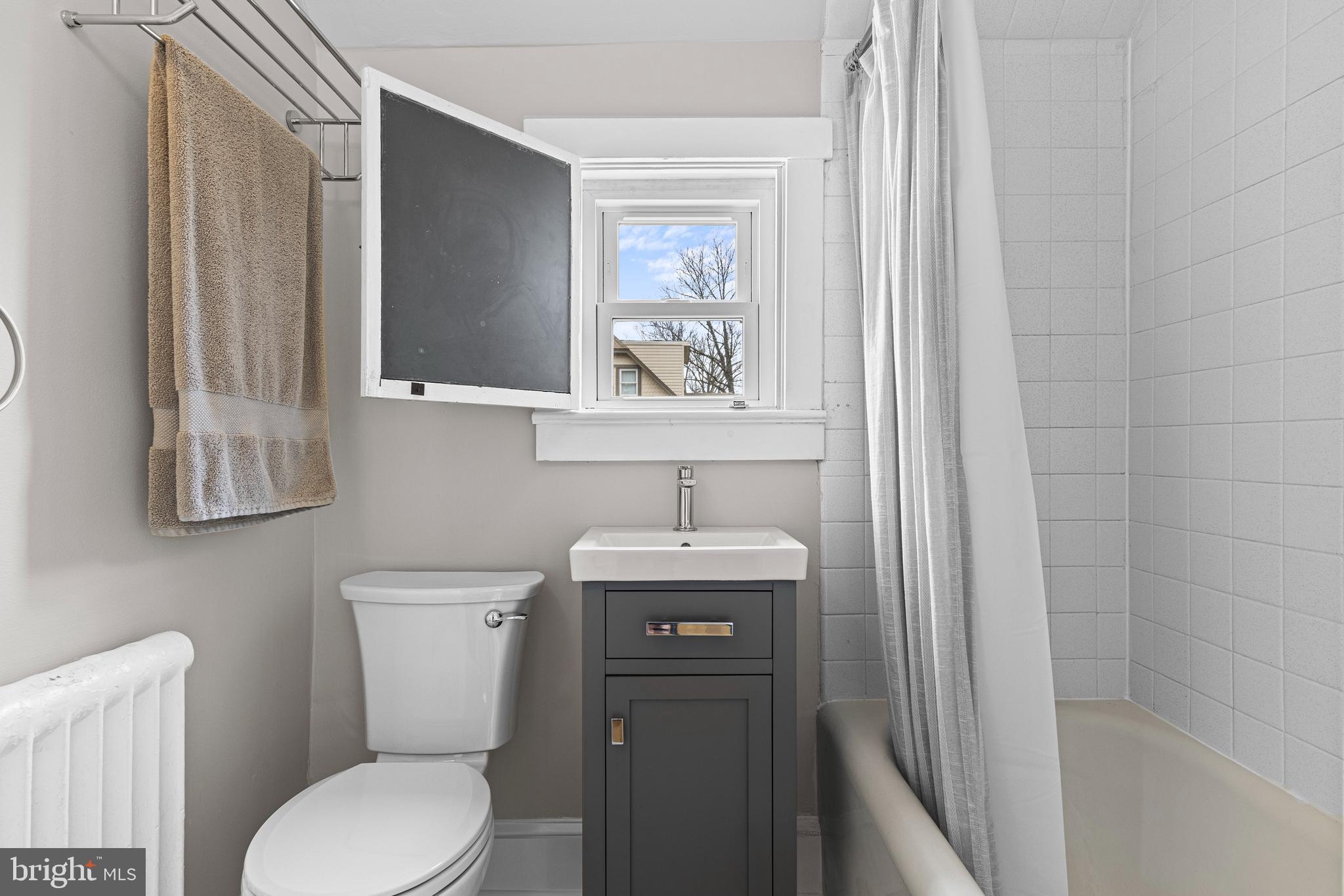 321 Conestoga Road Wayne, PA 19087 - Photo 16 of 28 a bathroom with a toilet a sink and a bathtub