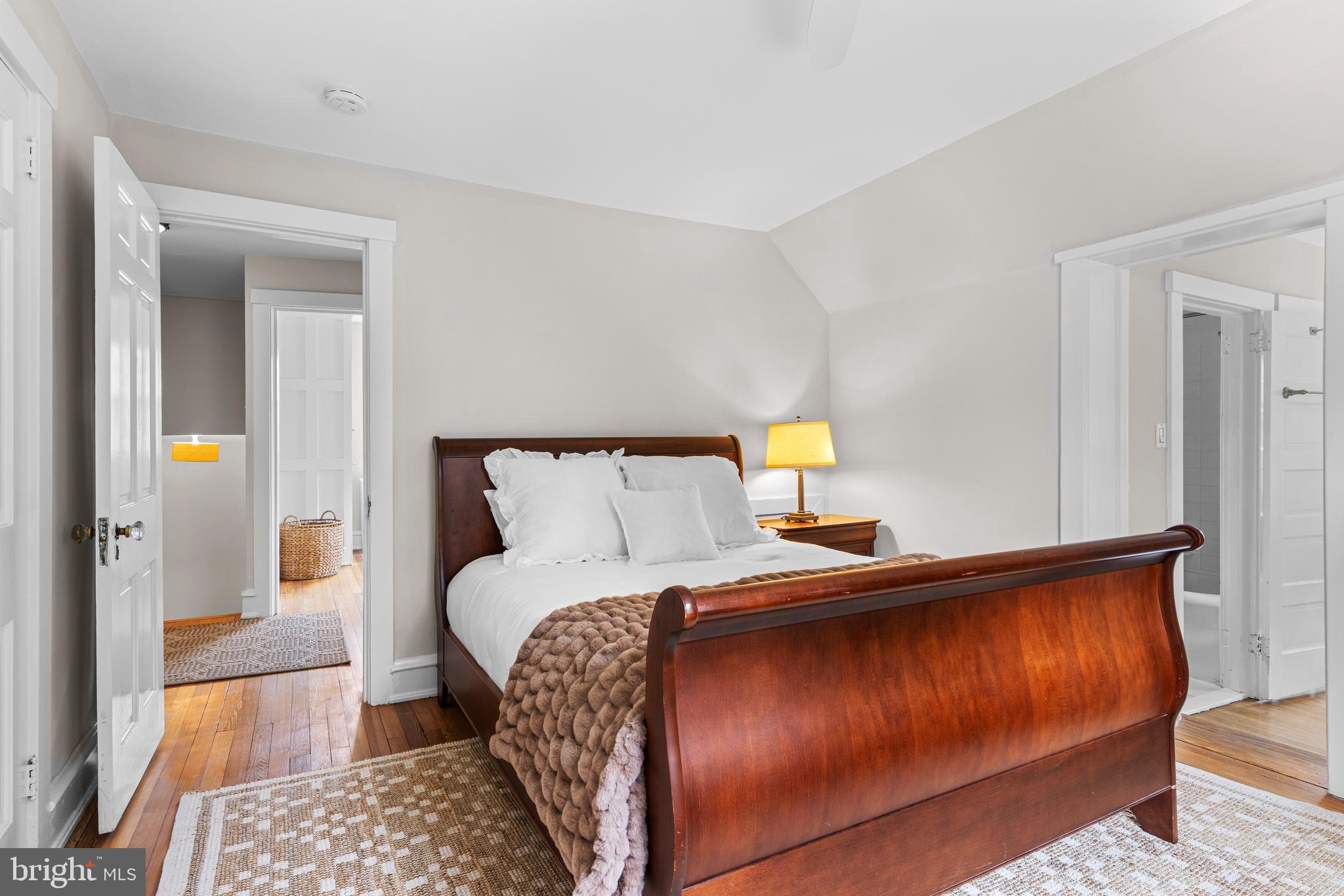 321 Conestoga Road Wayne, PA 19087 - Photo 18 of 28 a bedroom with a bed and wooden floor