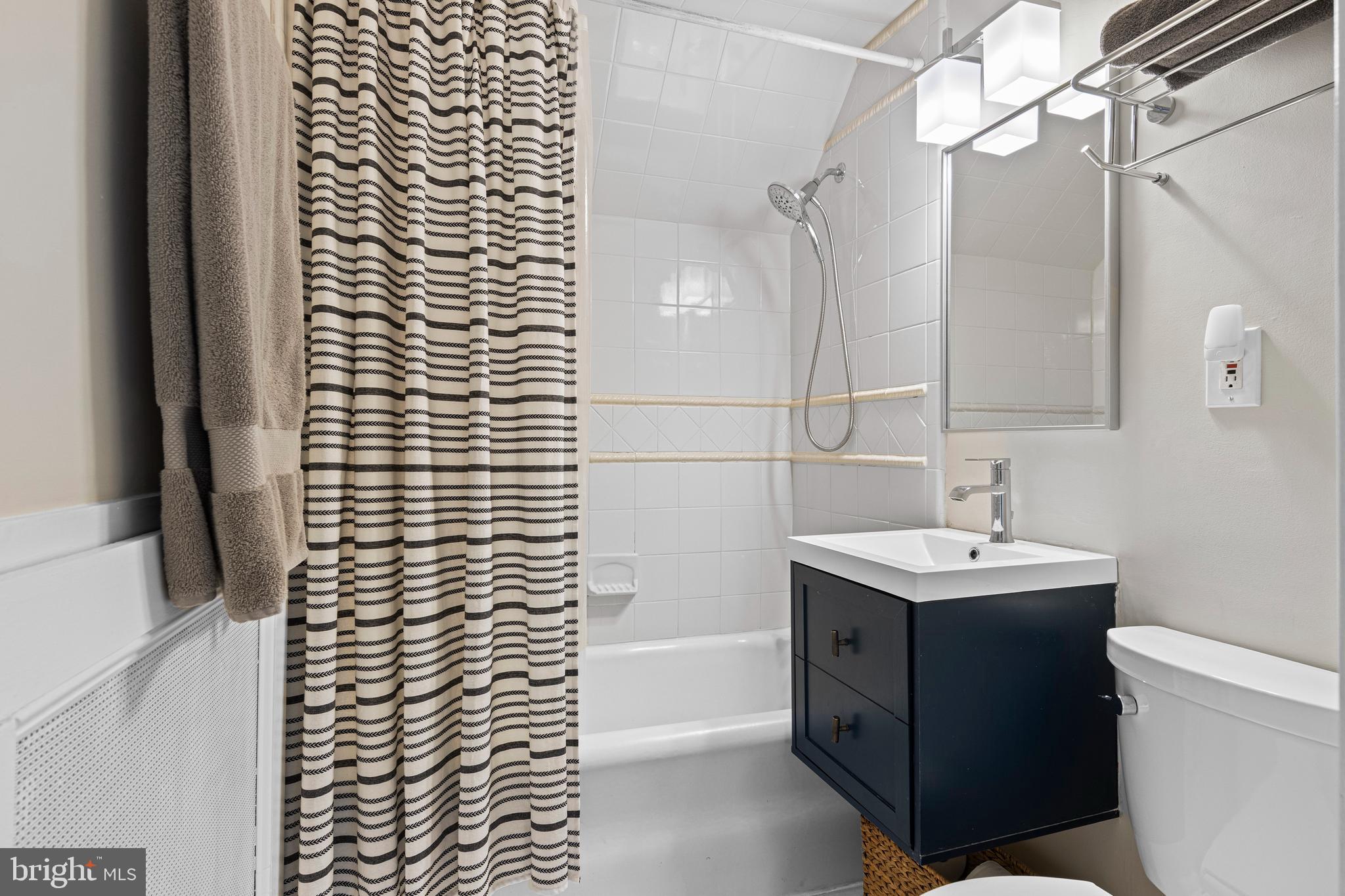 321 Conestoga Road Wayne, PA 19087 - Photo 20 of 28 a bathroom with a sink a toilet and shower