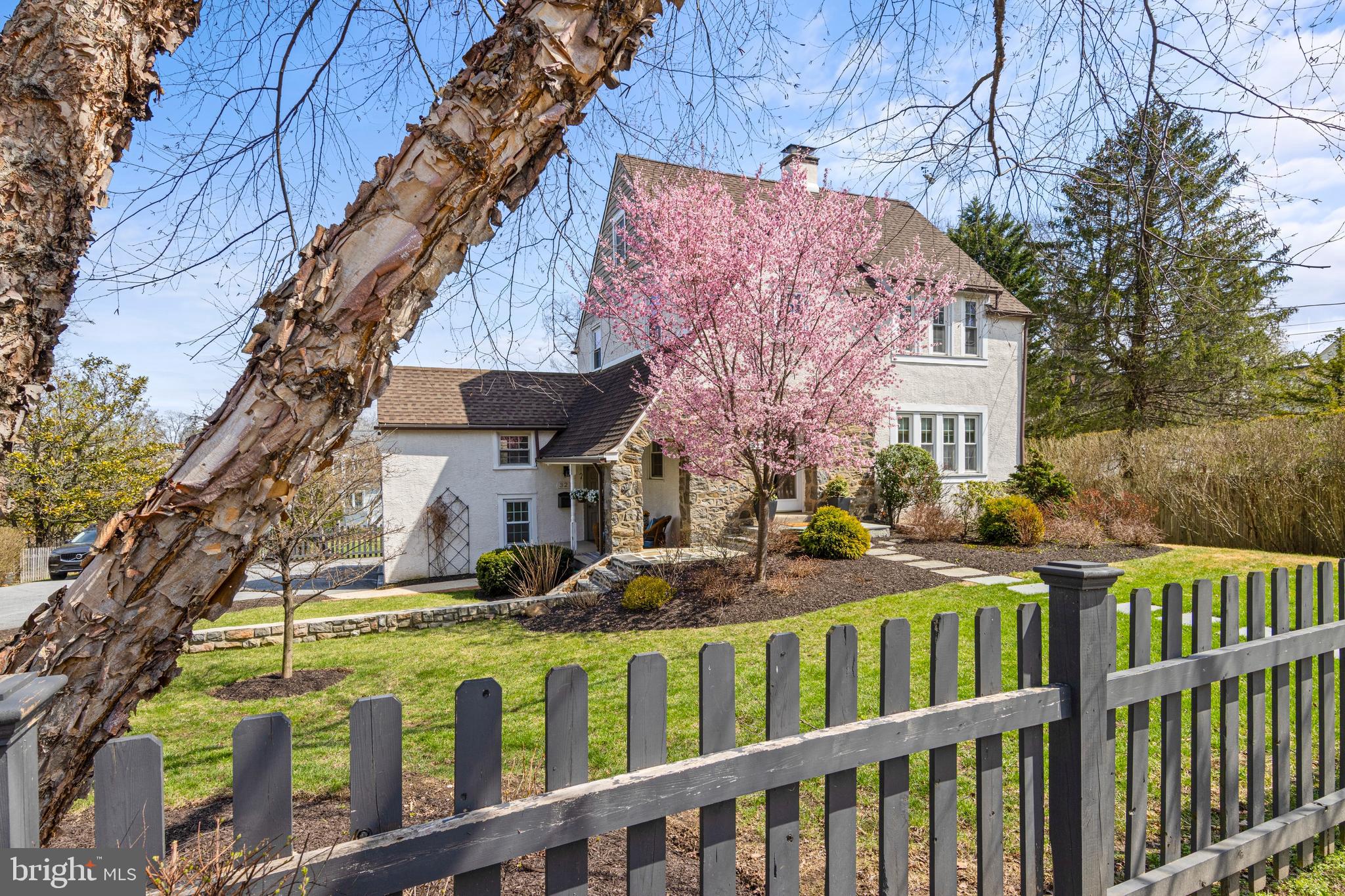 321 Conestoga Road Wayne, PA 19087 - Photo 2 of 28 a front view of house with a garden