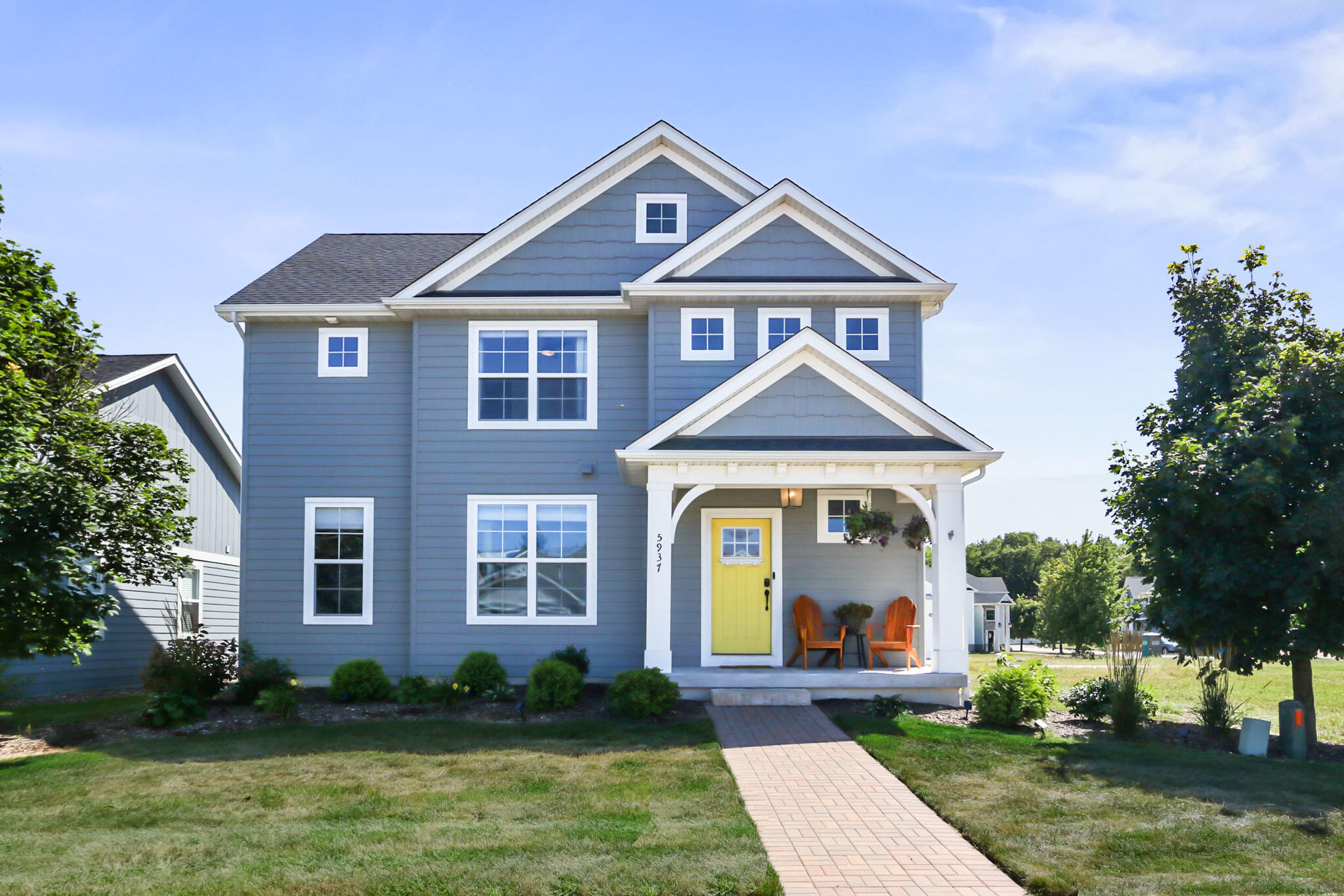 a front view of a house with garden