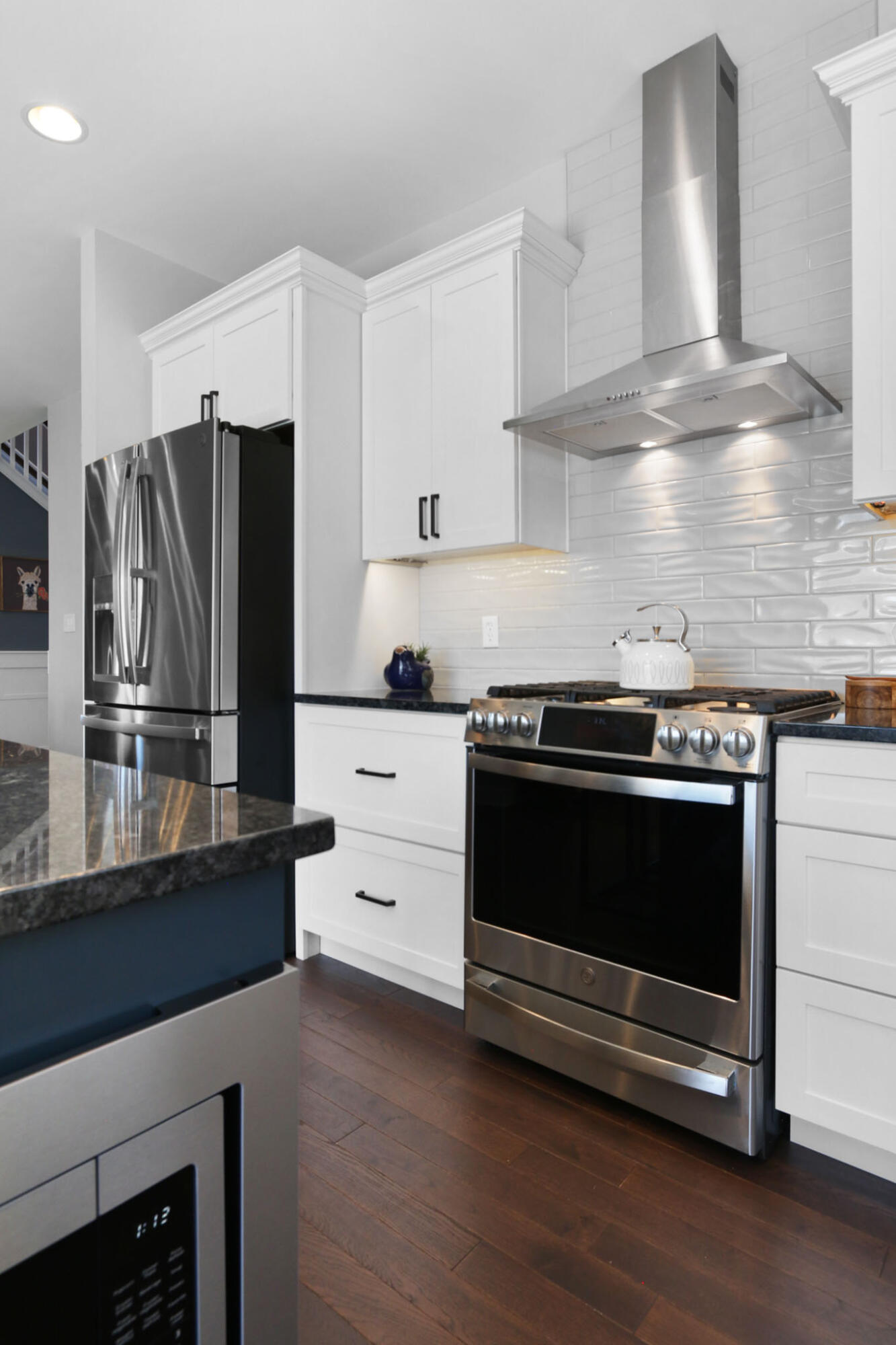 5937 South Dune Harbor Drive Portage, IN 46368 - Photo 16 of 44 a kitchen with granite countertop a stove microwave and refrigerator