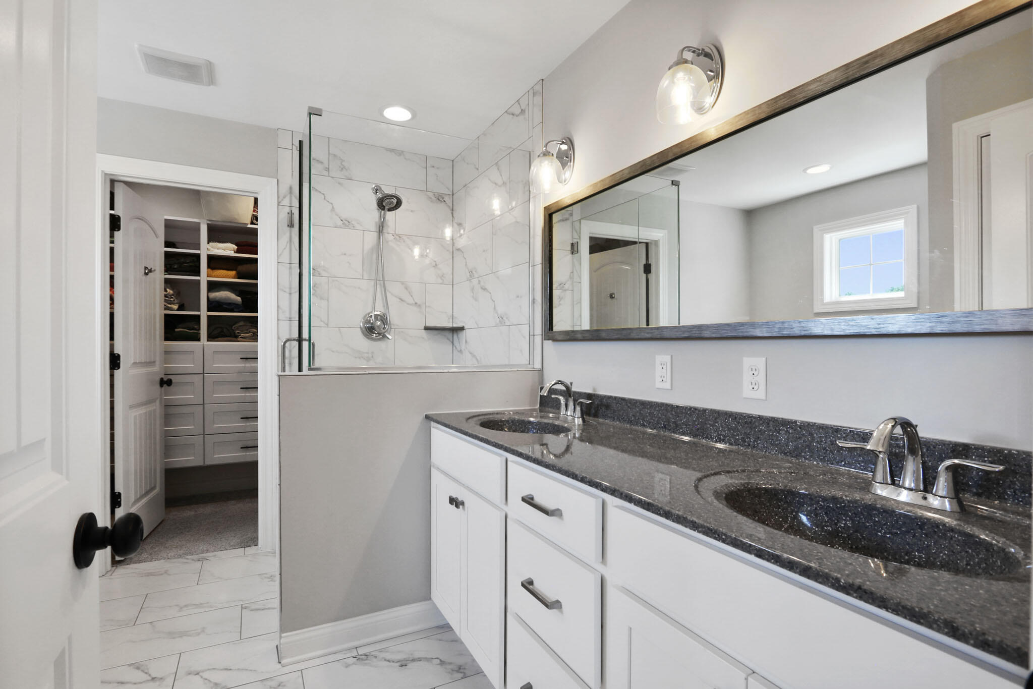 5937 South Dune Harbor Drive Portage, IN 46368 - Photo 25 of 44 a bathroom with a granite countertop sink a mirror and shower