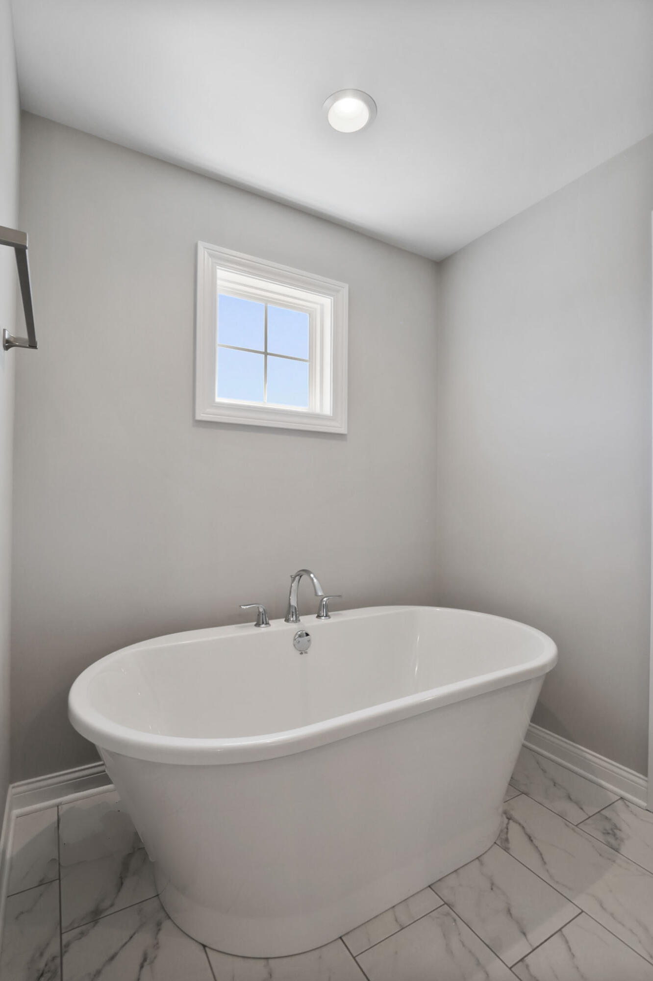 5937 South Dune Harbor Drive Portage, IN 46368 - Photo 26 of 44 a white bath tub sitting in a bathroom