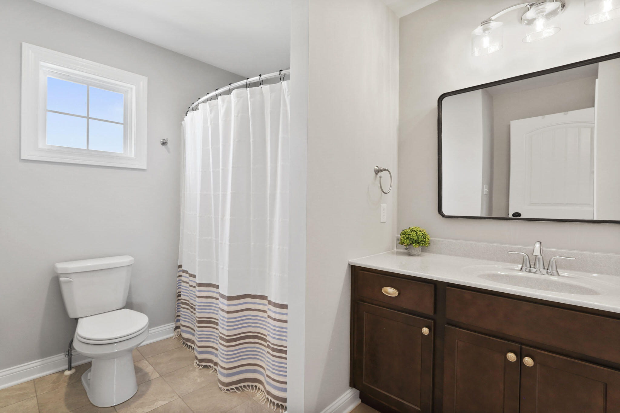 5937 South Dune Harbor Drive Portage, IN 46368 - Photo 28 of 44 a bathroom with a sink a toilet and a mirror