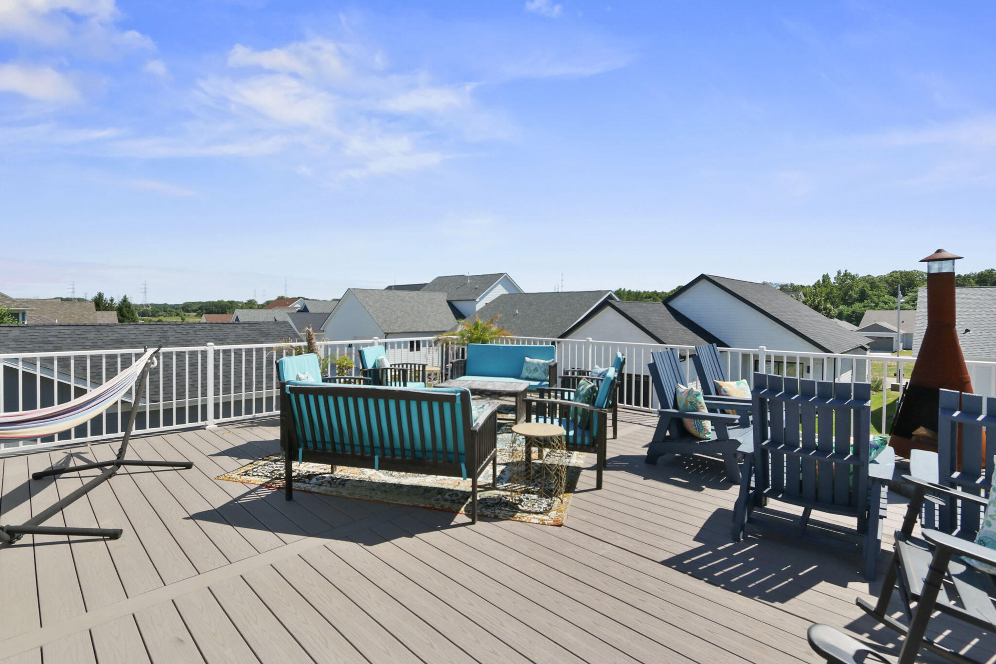 5937 South Dune Harbor Drive Portage, IN 46368 - Photo 31 of 44 a view of a roof deck with table and chairs with wooden floor and fence