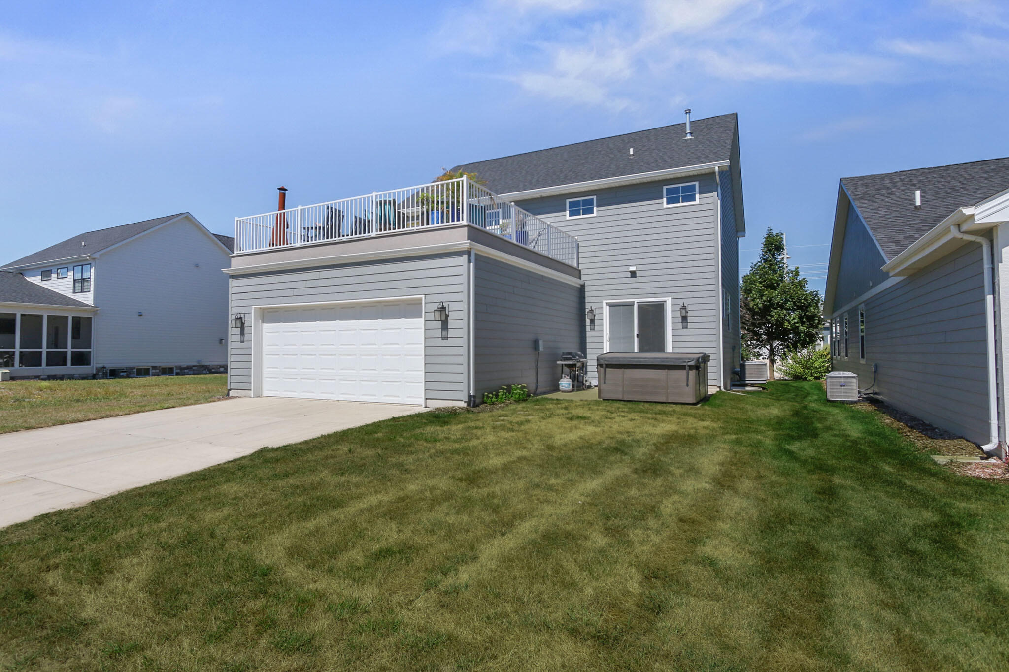 5937 South Dune Harbor Drive Portage, IN 46368 - Photo 38 of 44 a view of a house with a yard and garage