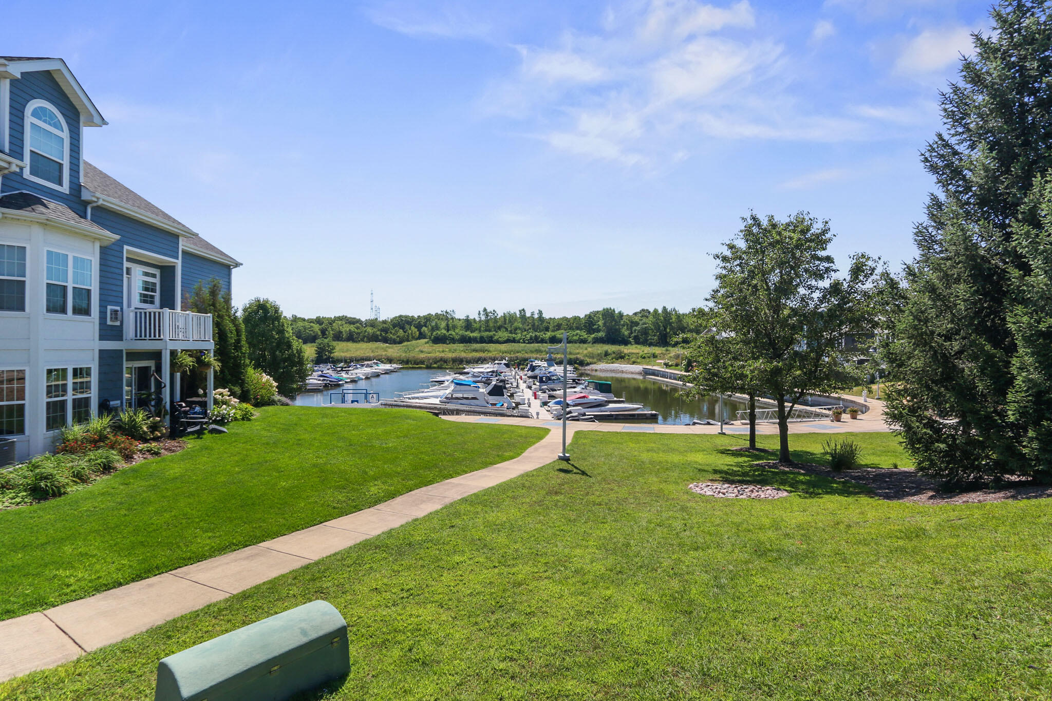 5937 South Dune Harbor Drive Portage, IN 46368 - Photo 44 of 44 a view of a big room with a big yard and potted plants and large tree