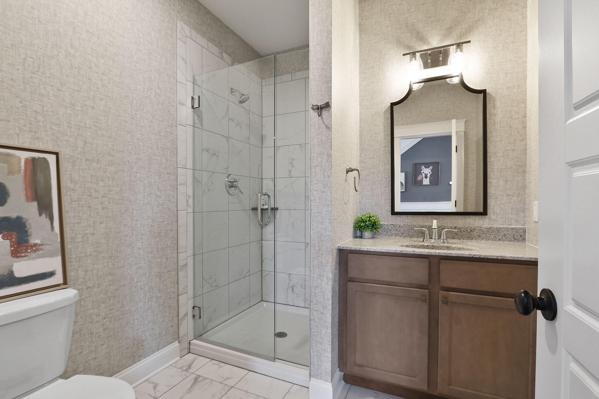 5937 South Dune Harbor Drive Portage, IN 46368 - Photo 8 of 44 a bathroom with a shower sink and mirror