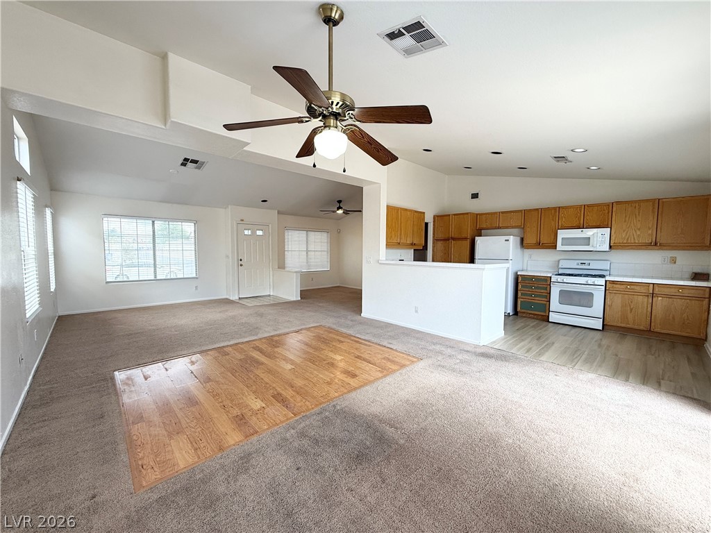 8870 Haviland Road Las Vegas, NV 89123 - Photo 2 of 24 An open-concept layout unites the kitchen and living areas, offering effortless flow.