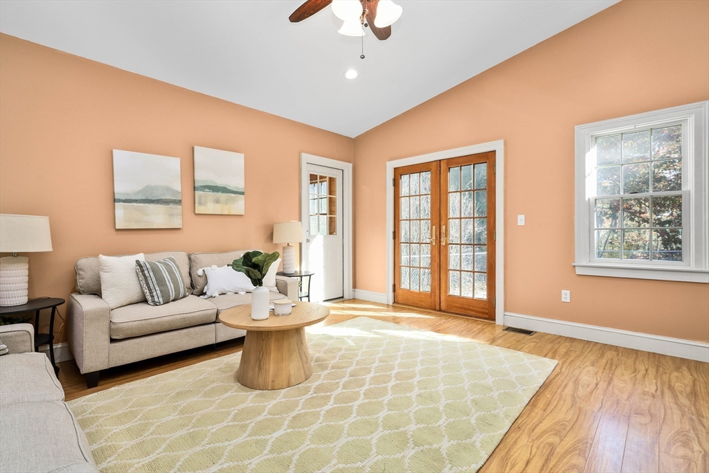 183 Burnt Swamp Road Wrentham, MA 02093 - Photo 18 of 38 a living room with furniture and a chandelier