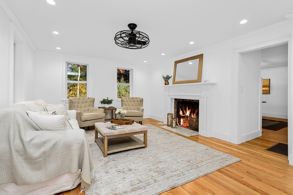 183 Burnt Swamp Road Wrentham, MA 02093 - Photo 6 of 38 a living room with furniture and a fireplace
