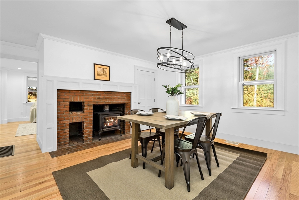 183 Burnt Swamp Road Wrentham, MA 02093 - Photo 8 of 38 a view of a dining room with furniture window and wooden floor