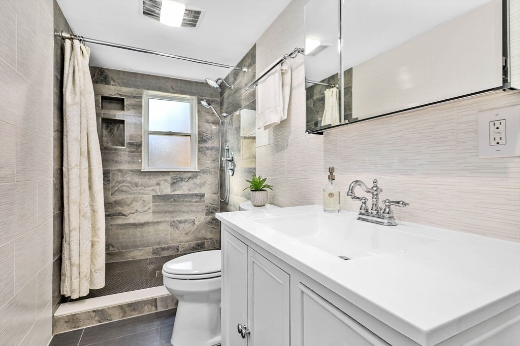 183 Burnt Swamp Road Wrentham, MA 02093 - Photo 10 of 38 a bathroom with a sink a toilet and shower