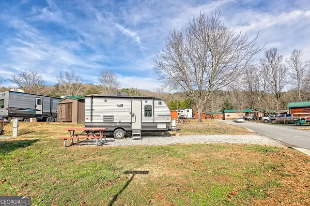 a view of a house with snow on the road