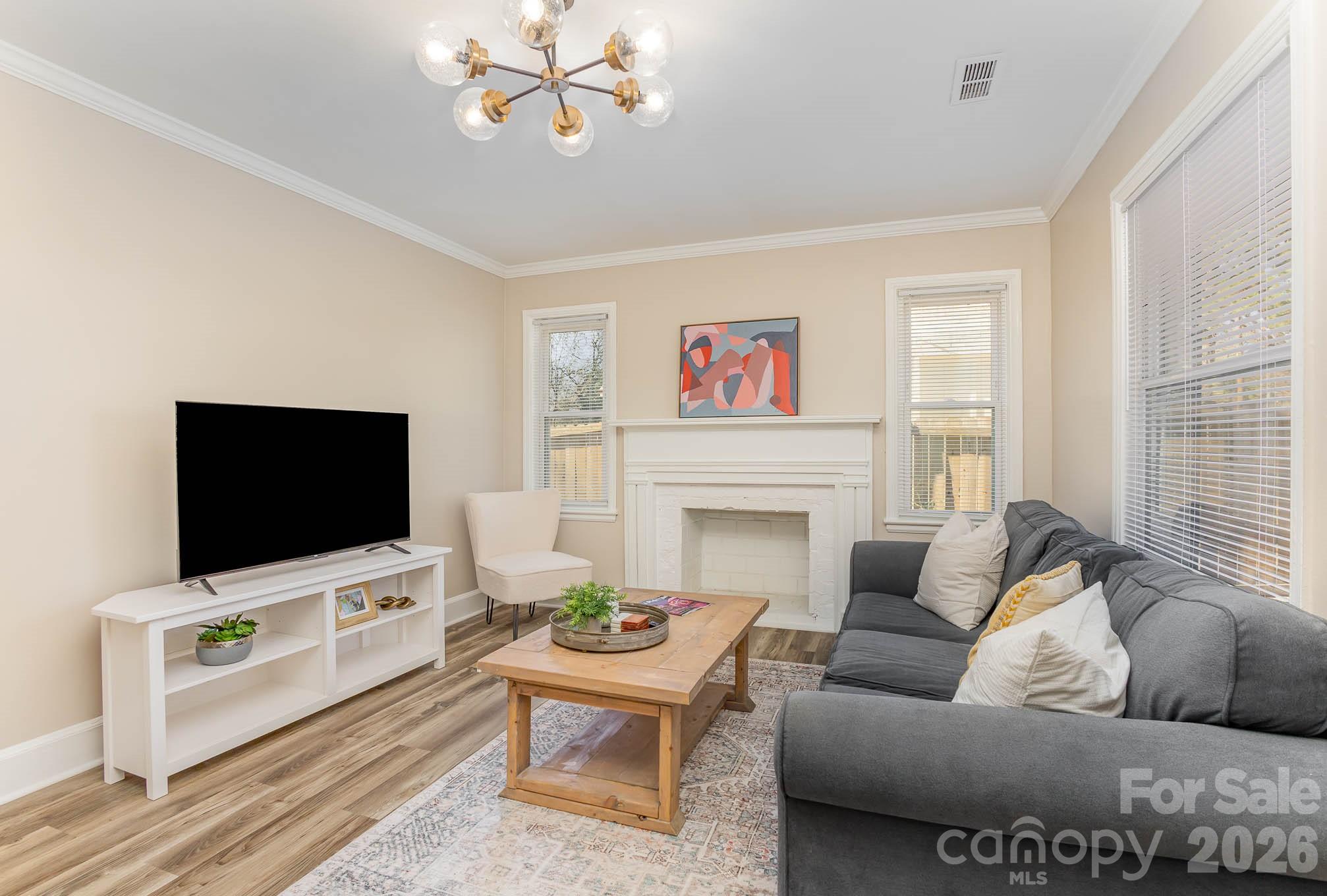 3141 Mathis Drive Charlotte, NC 28208 - Photo 2 of 12 a living room with furniture and a flat screen tv