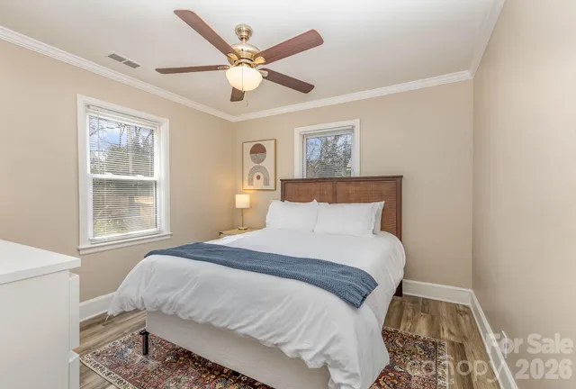 a bedroom with a large bed and a window