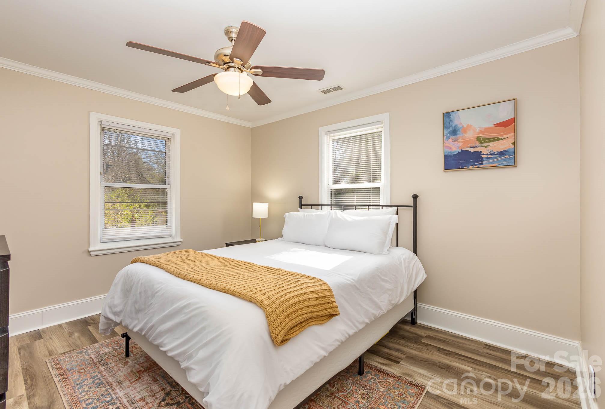3141 Mathis Drive Charlotte, NC 28208 - Photo 10 of 12 a bedroom with a large bed and a window
