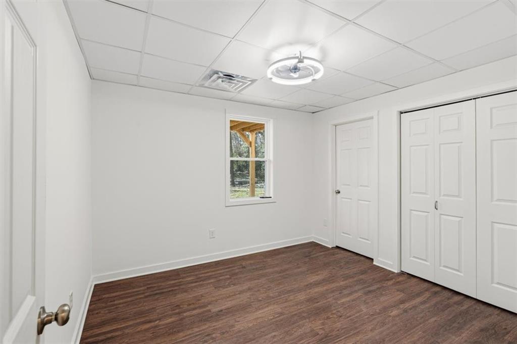 49 Apache Trail Cartersville, GA 30120 - Photo 36 of 52 wooden floor in an empty room with a window