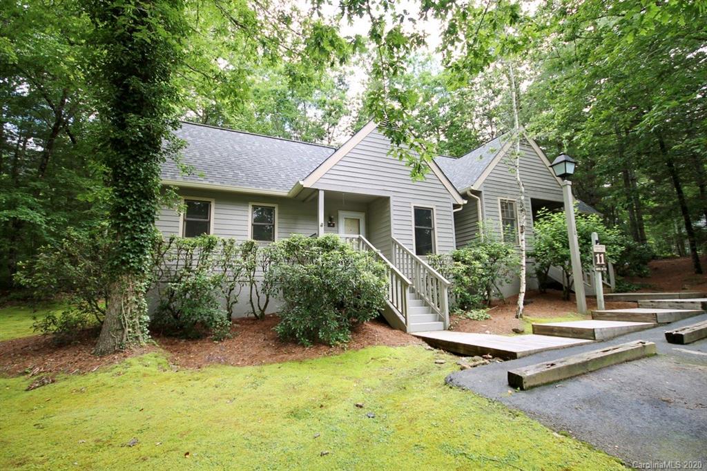 10 Dwarf Mountain Road, Unit 22 Sapphire, NC 28774 - Photo 2 of 23 a house view with a garden space