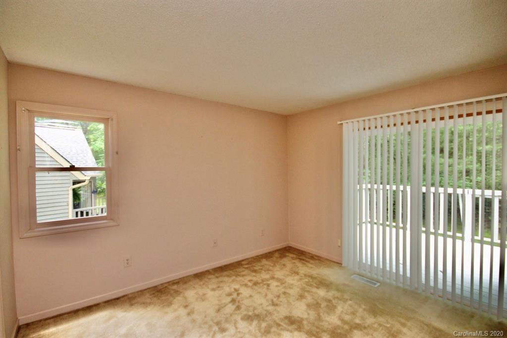 10 Dwarf Mountain Road, Unit 22 Sapphire, NC 28774 - Photo 11 of 23 a view of an empty room with a window